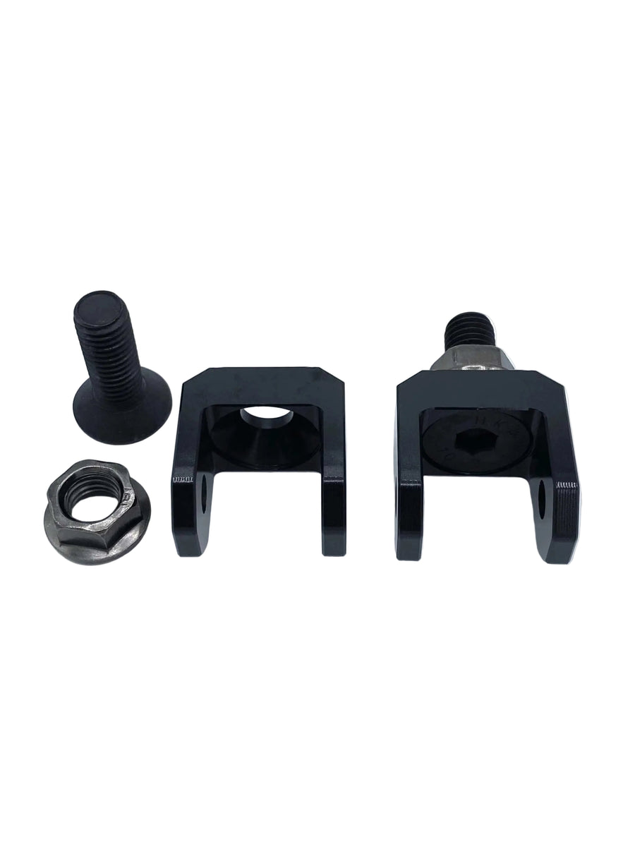 Set of black metal components including a bolt, nut, and two clamps on a white background