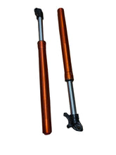 Load image into Gallery viewer, Two orange and silver motorcycle front forks with black mounting hardware, placed on a wooden floor.
