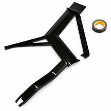 Load image into Gallery viewer, A glossy black metal mechanical bracket or frame piece shown on a clean white background, with a roll of black tape placed to the upper right.
