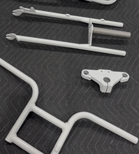 Load image into Gallery viewer, hite powder-coated Super73 Z1 handlebar, along with the necessary clamps and front suspension components.

