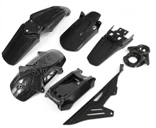 Load image into Gallery viewer, Gloss carbon fiber-look Sur-Ron plastics, fenders and protective covers by Sheron Universe, curated by K. Mods
